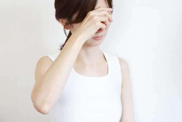 具合が悪い女性